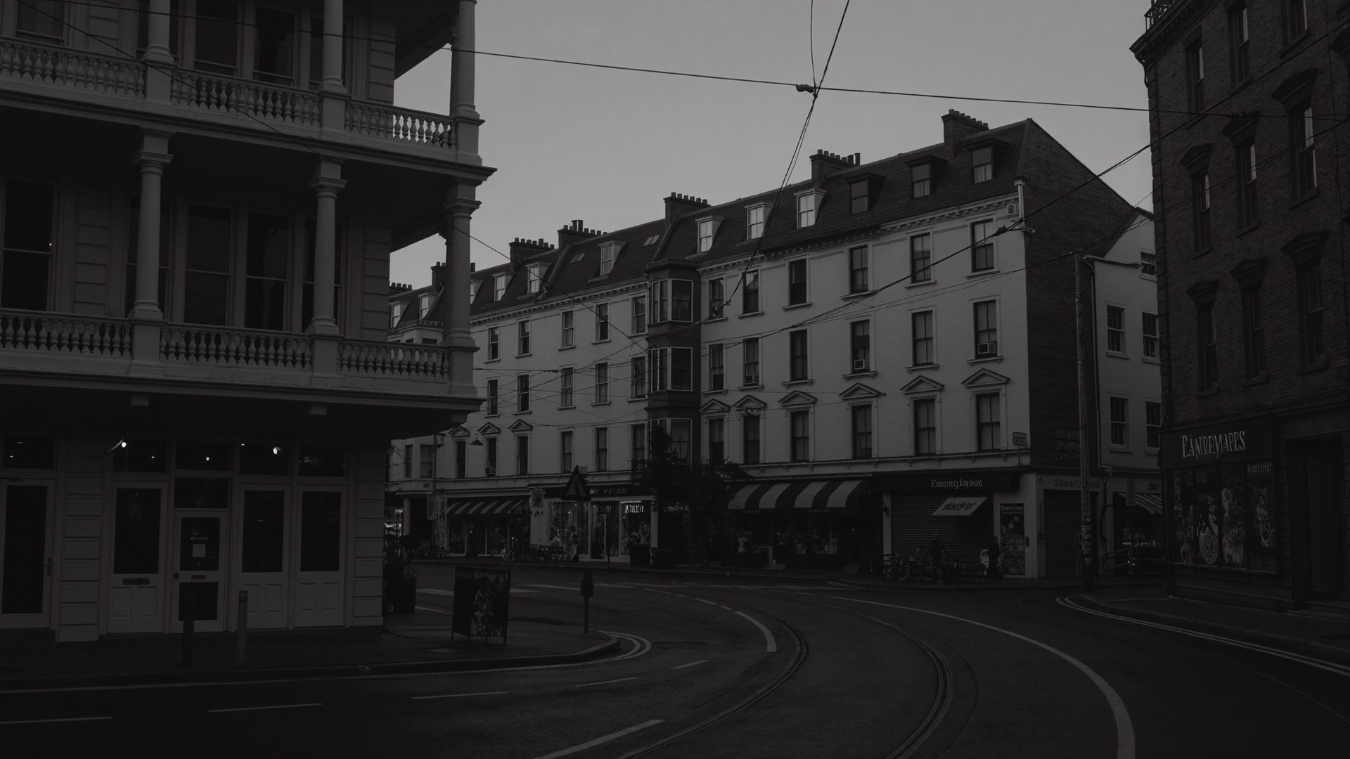 A Melbourne street of Victorian shopfronts at dusk